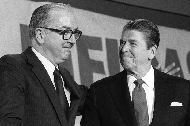 President Ronald Reagan greets Jesse Helms at a dinner honoring the North Carolina Republican, June 16, 1983. (AP/Ed Reinke)