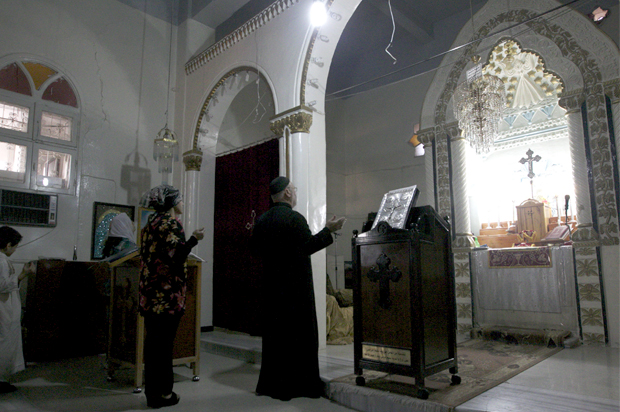 People attend a mass at the Syriac Orthodox Church in Al-Darbasiyah, Hasakah province November 13, 2013. (Reuters)