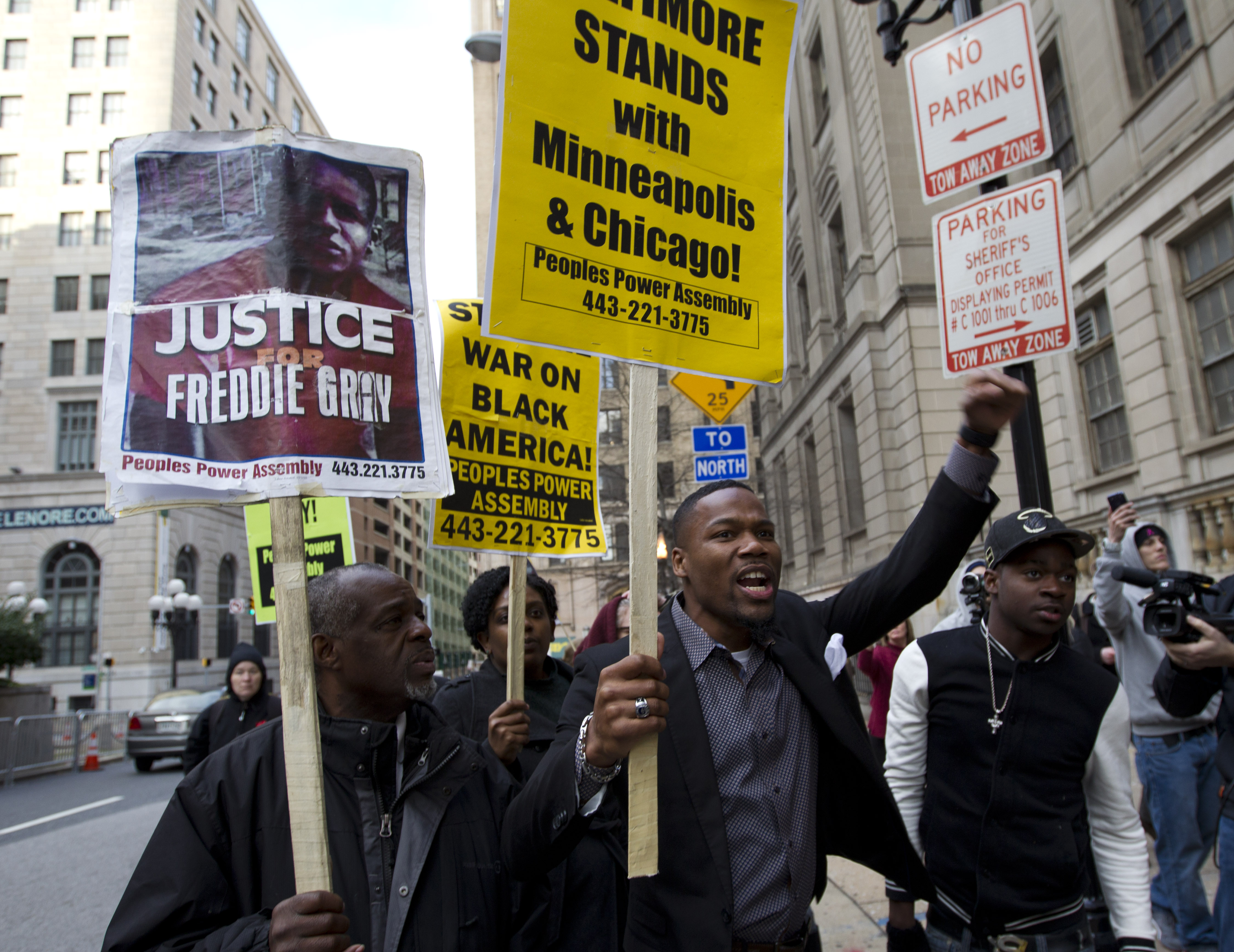 Demonstrators protest outside of the courthouse in response to a hung jury and mistrial for Officer William Porter, one of six Baltimore city police officers charged in connection to the death of Freddie Gray, Wednesday, Dec. 16, 2015, in Baltimore Md.  (AP Photo/Jose Luis Magana) (AP)