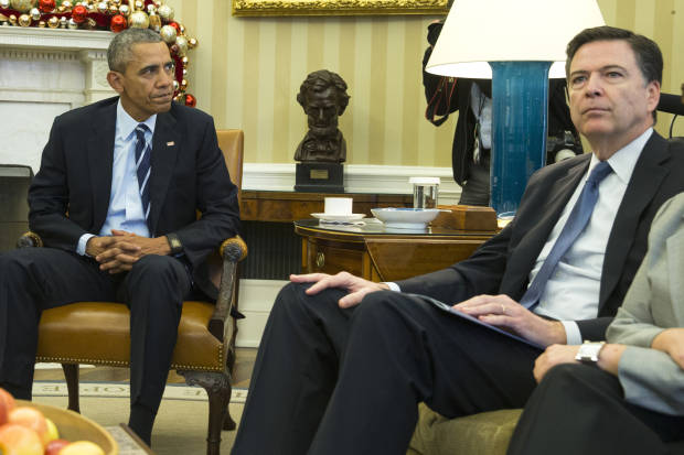 President Barack Obama sits with FBI director James Comey (AP Photo/Evan Vucci)