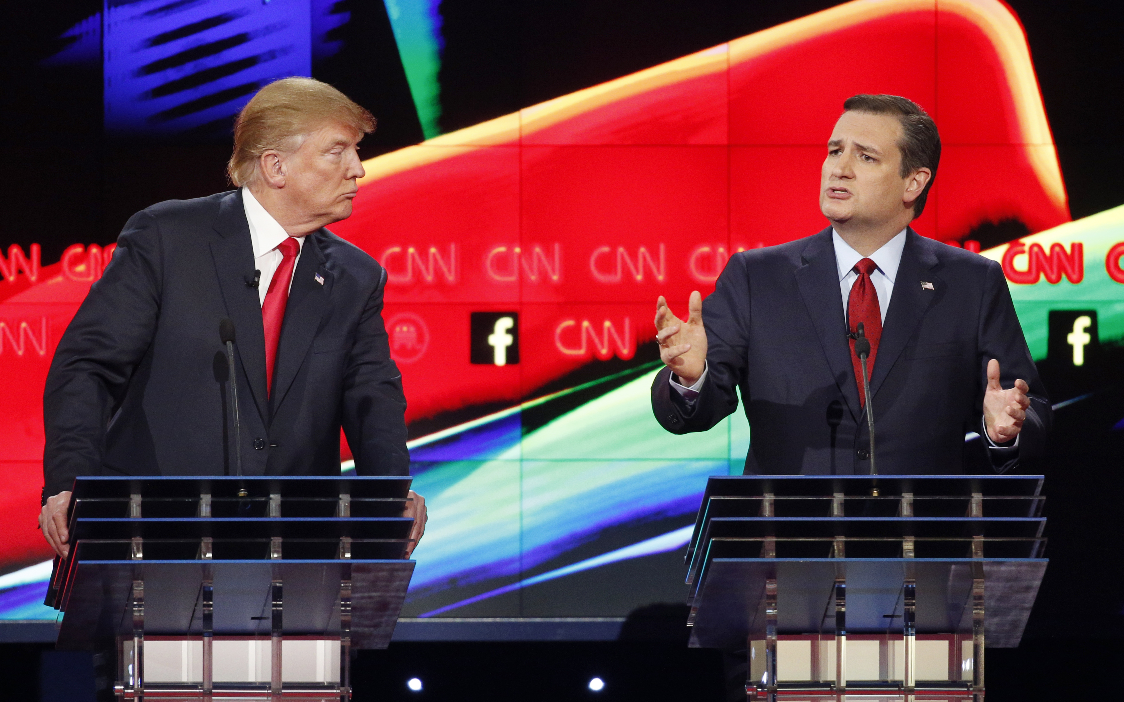In this Dec. 15, 2015 photo, Donald Trump, left, watches as Ted Cruz speaks during the CNN Republican presidential debate at the Venetian Hotel & Casino in Las Vegas. A growing debate over Americas role in promoting regime change in the Middle East is creating unusual alliances among 2016 presidential candidates that cross party lines.  (AP Photo/John Locher) (AP)