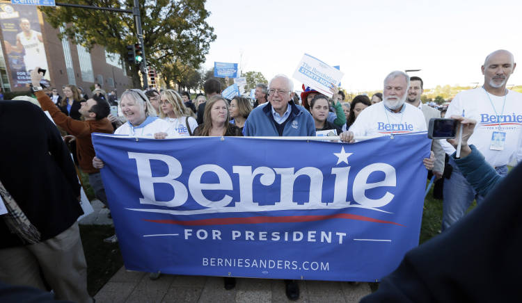 FILE - In this Oct. 24, 2015, file photo, Democratic presidential candidate, Sen. Bernie Sanders, I-Vt., walks with supporters following a rally before the state Democratic party's Jefferson-Jackson fundraising dinner in Des Moines, Iowa. (AP Photo/Charlie Neibergall, File) (AP)