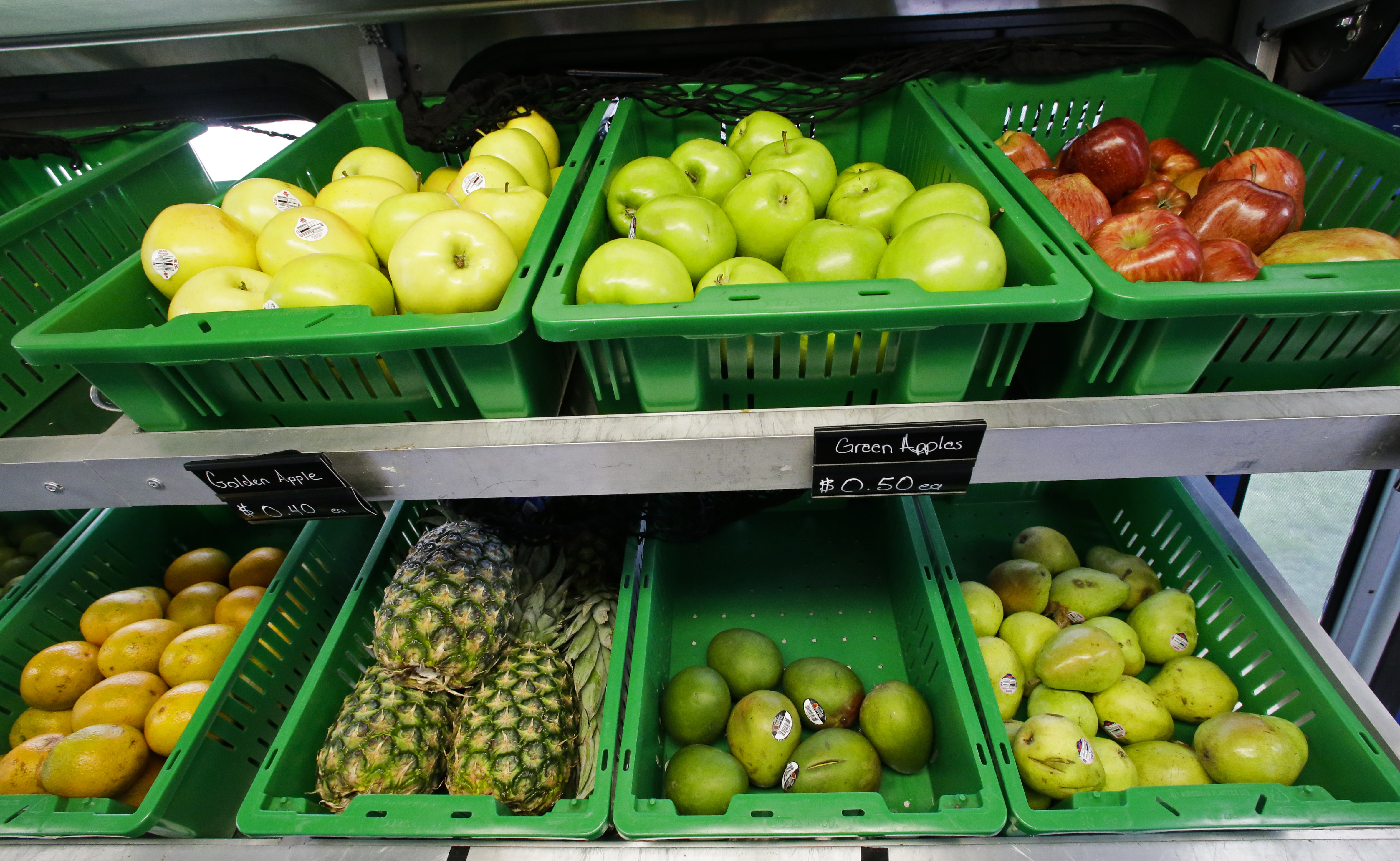 In this Wednesday, July 15, 2015 photo, a selection of fresh fruits available on the Fresh Stop bus, a mobile market, are seen in Eatonville, Fla. (AP Photo/John Raoux) (AP)