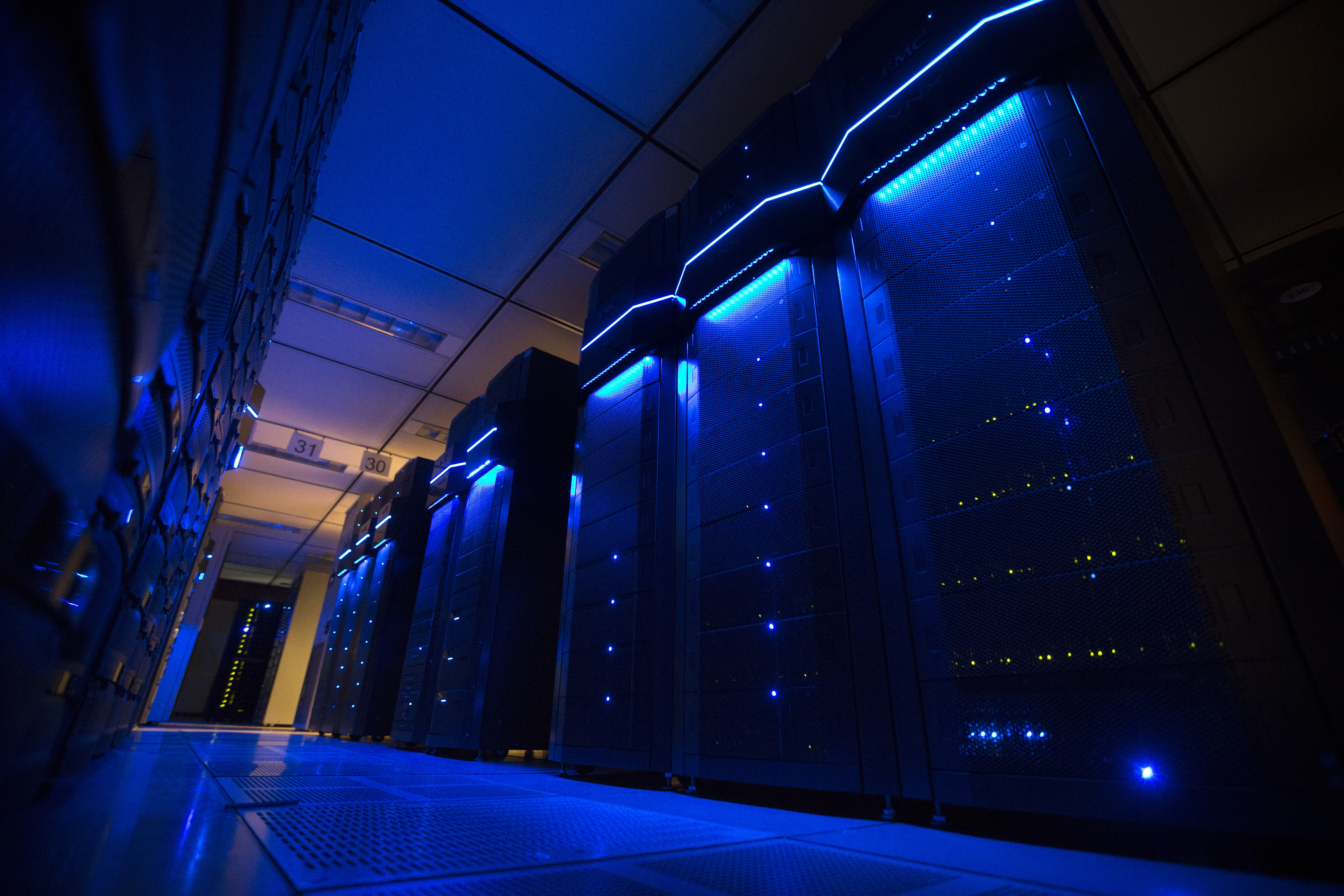 This Wednesday, May 20, 2015 photo shows server banks inside a data center at AEP headquarters in Columbus, Ohio. Like most big utilities, AEP's power plants, substations and other vital equipment are managed by a network that is separated from the company's business software with layers of authentication, and is not accessible via the Internet. Creating that separation, and making sure that separation is maintained, is among the most important things utilities can do to protect the grid's physical assets. (AP Photo/John Minchillo) (AP)