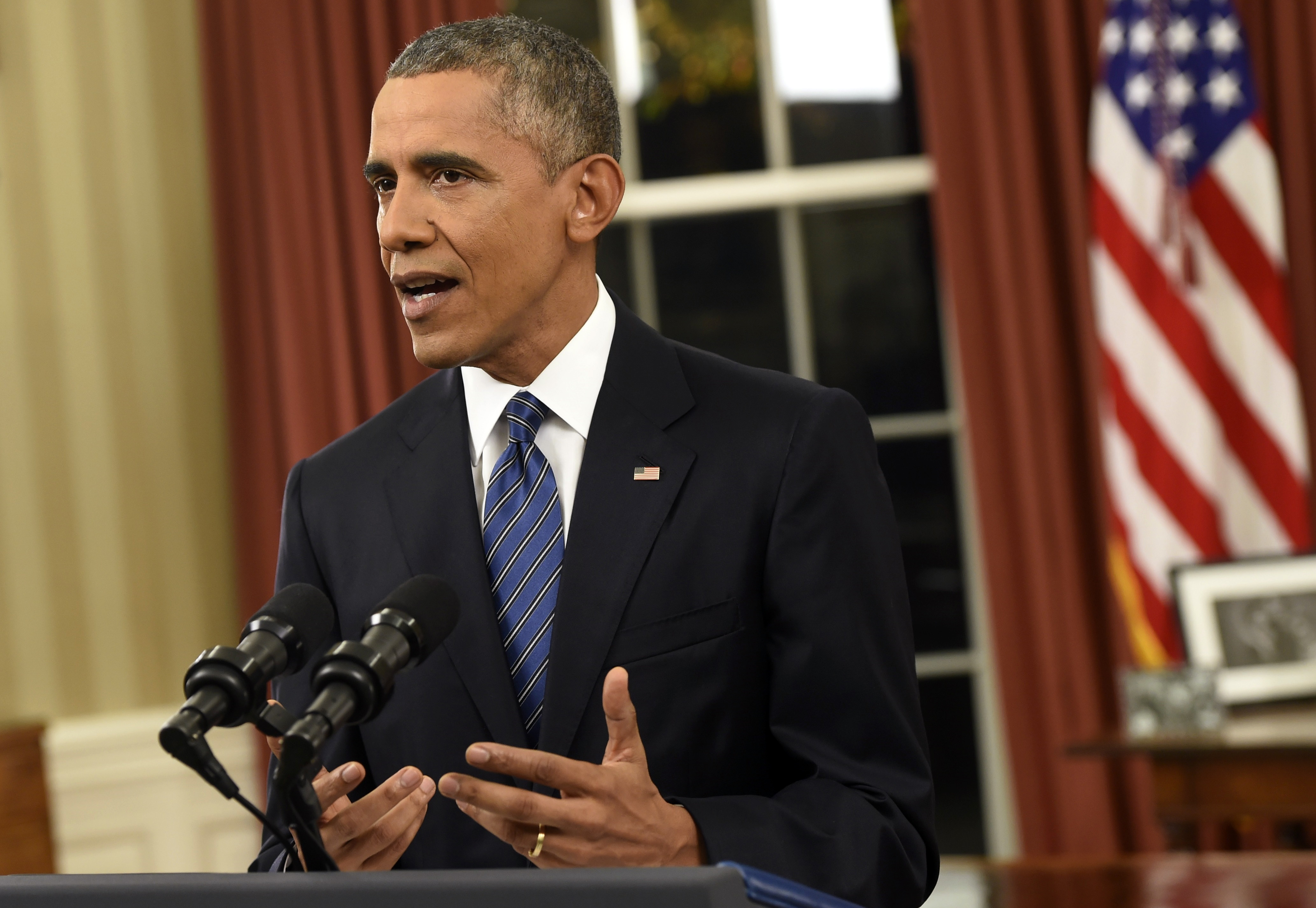 President Barack Obama addresses the nation from the Oval Office at the White House in Washington, Sunday night, Dec. 6, 2016.  In a rare Oval Office address, Obama vowed the United States would overcome a terror threat that has entered a "new phase" as he sought to reassure Americans shaken by recent attacks in Paris and California.   (Saul Loeb/Pool Photo via AP) (AP)
