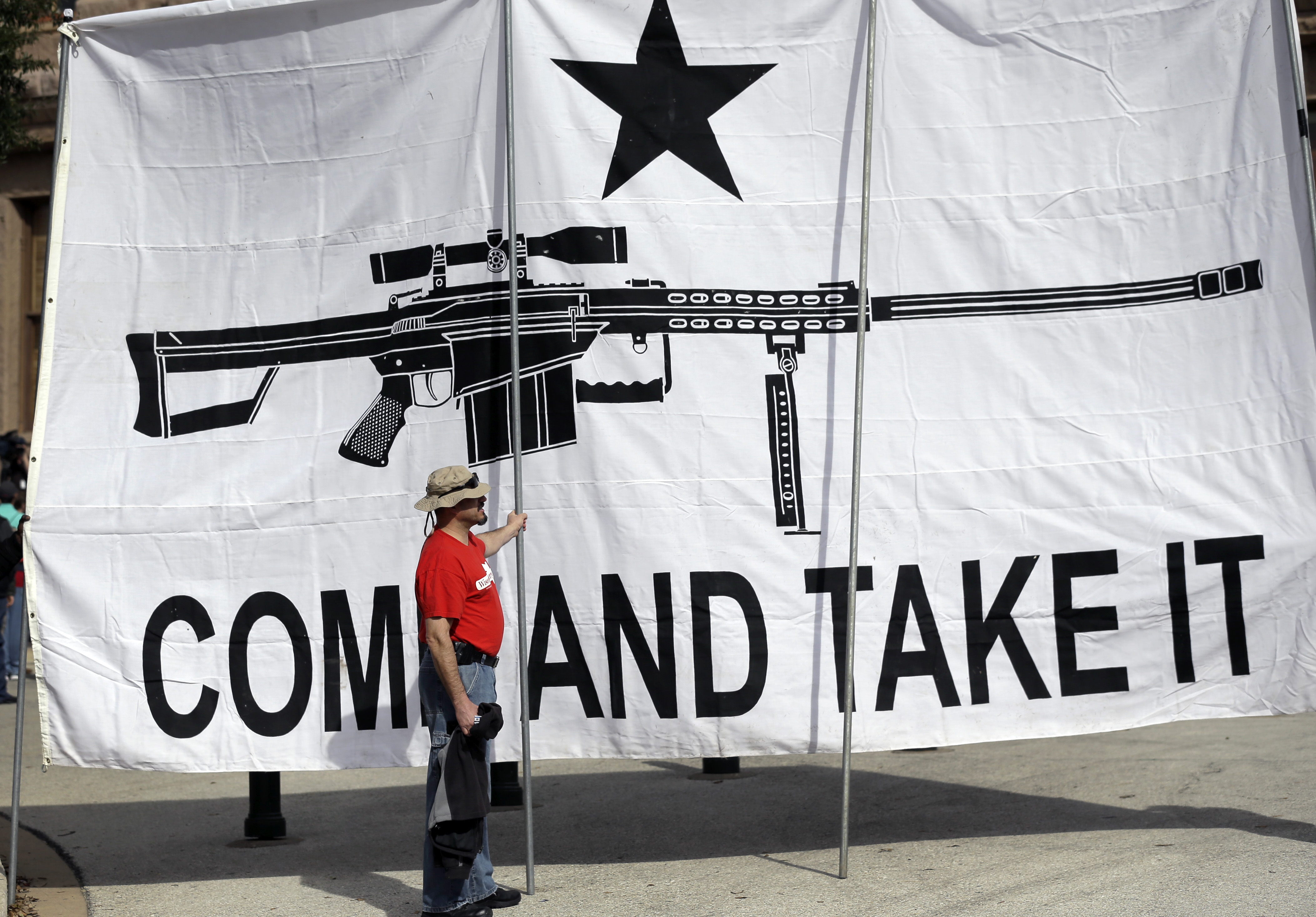 A "Come and Take It" banner at a rally in support of open carry gun laws at the Capitol, in Austin, Texas in 2015 (AP Photo/Eric Gay, File)