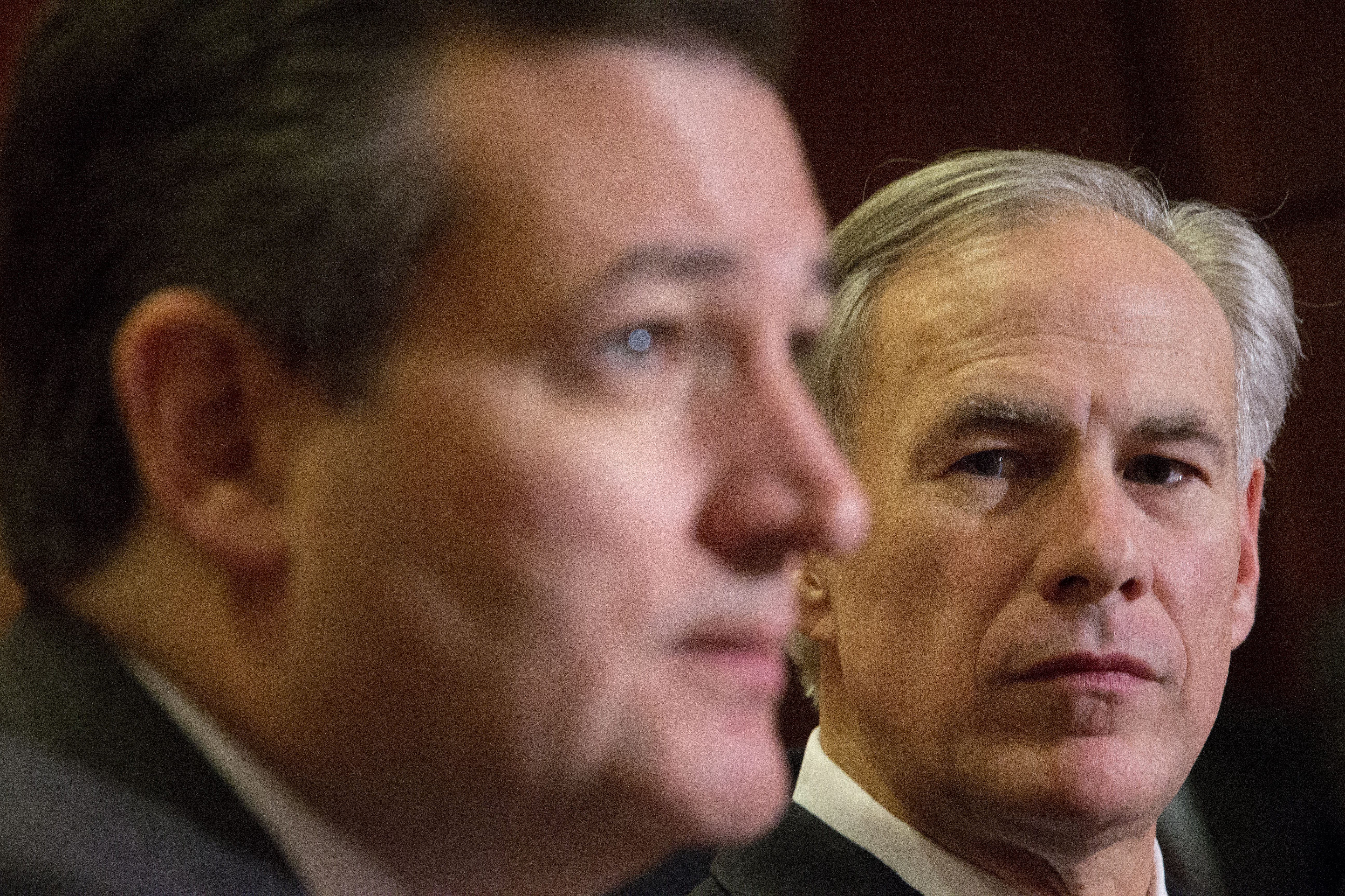 Texas Gov. Greg Abbott. right, listens to Republican presidential candidate Sen. Ted Cruz, R-Texas, left, speak about the resettlement of Syrian refugees in the U.S., during their joint news conference on Capitol Hill in Washington, Tuesday, Dec. 8, 2015.   Abbott was in Washington with Cruz to support a bill Cruz has introduced in Congress banning any refugees from Iraq, Syria or other countries deemed to be controlled by a foreign terrorist organization.  (AP Photo/Pablo Martinez Monsivais) (AP)