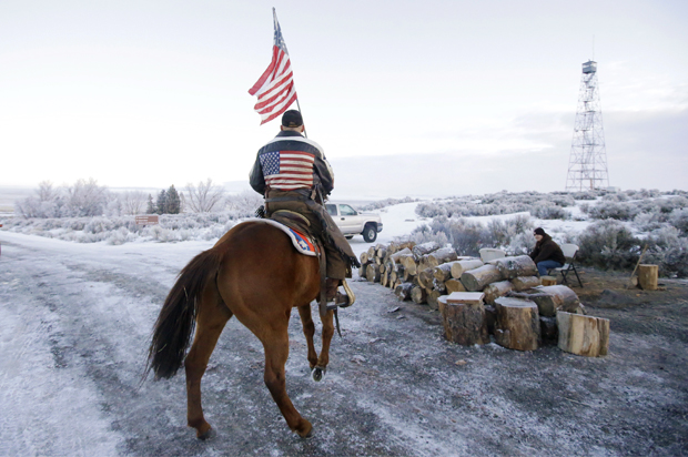 Cowboy Dwane Ehmer, of Irrigon Ore., a supporter of the group occupying the Malheur National Wildlife Refuge, rides his horse at Malheur National Wildlife Refuge Friday, Jan. 8, 2016, near Burns, Ore. (AP/Rick Bowmer)