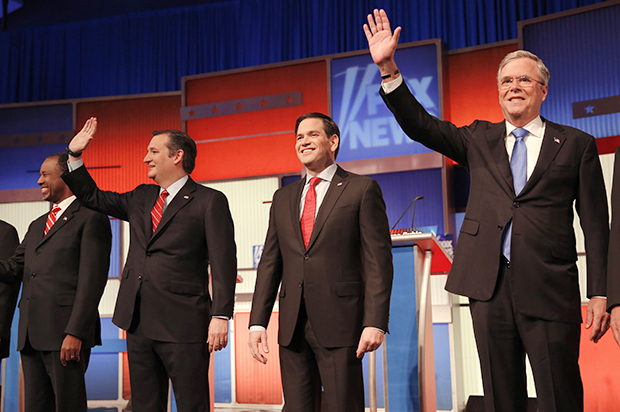 Ben Carson, Ted Cruz, Marco Rubio and Jeb Bush pose together at the start of the Republican debate, January 28, 2015. (Reuters/Carlos Barria)