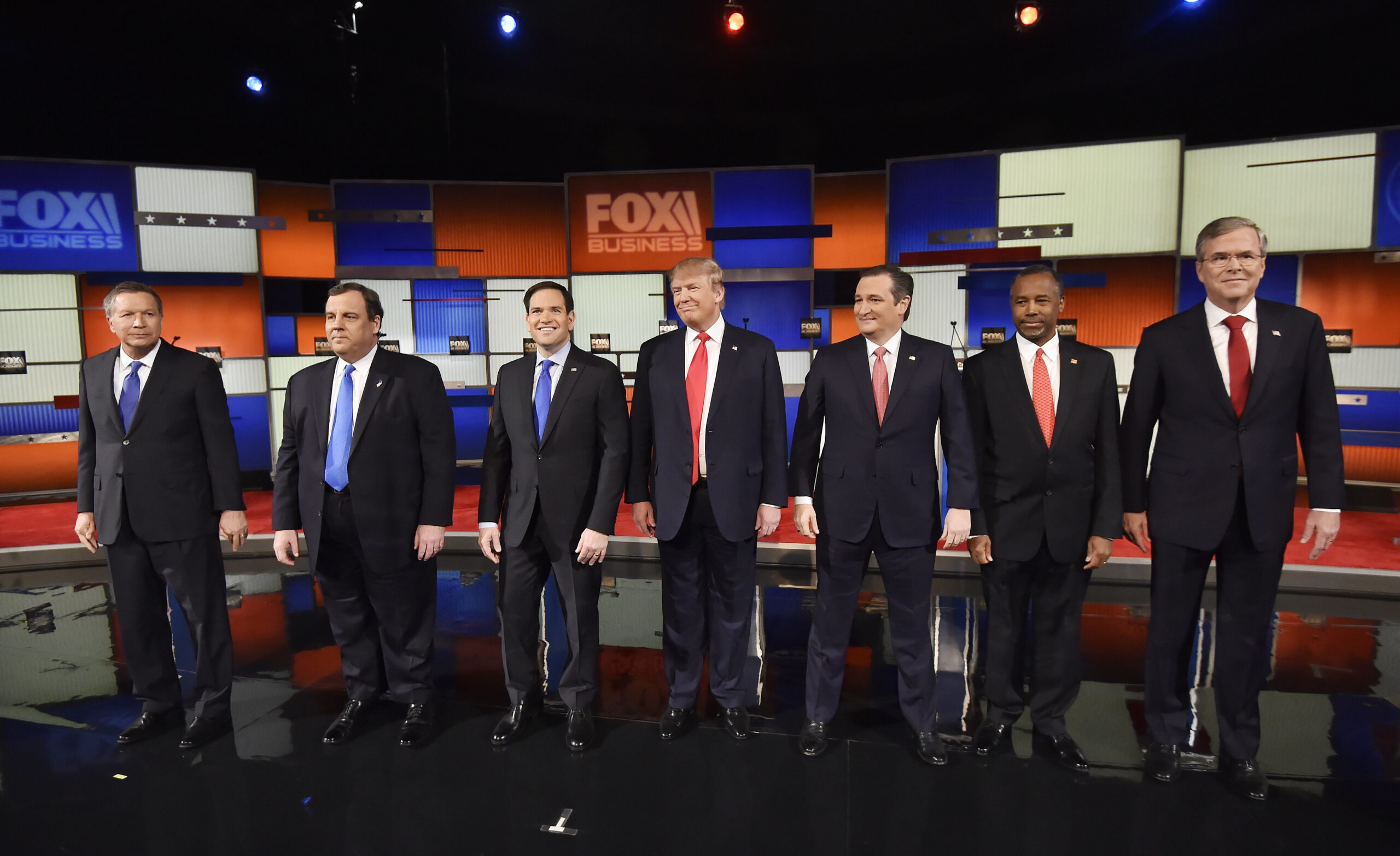 Republican presidential candidates, from left, Ohio Gov. John Kasich, New Jersey Gov. Chris Christie, Sen. Marco Rubio, R-Fla., businessman Donald Trump, Sen. Ted Cruz, R-Texas, retired neurosurgeon Ben Carson and former Florida Gov. Jeb Bush take the stage before the Fox Business Network Republican presidential debate at the North Charleston Coliseum, Thursday, Jan. 14, 2016, in North Charleston, S.C. (AP Photo/Rainier Ehrhardt) (AP)