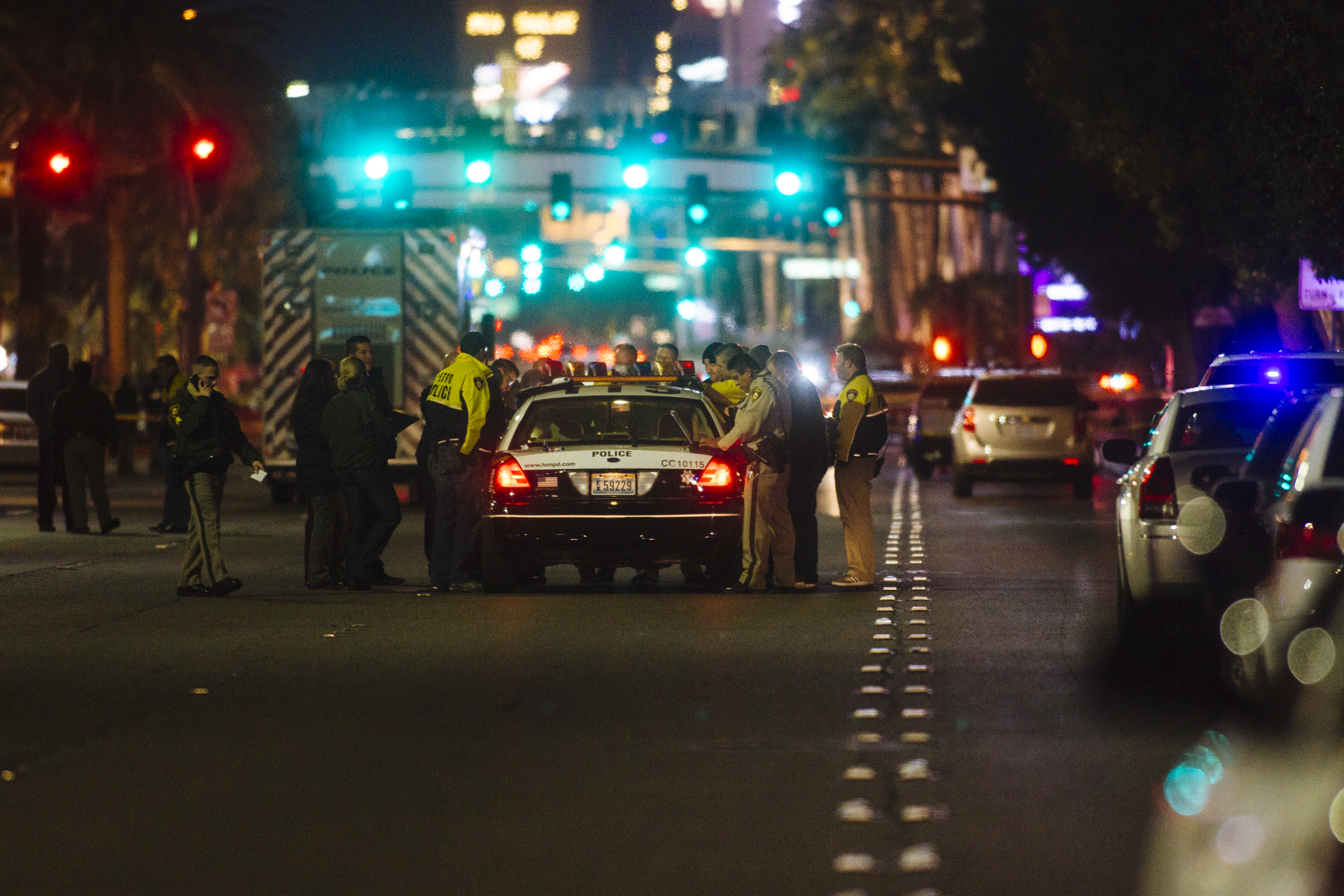 Metro Police officers block Las Vegas Boulevard South at the scene of an officer-involved shooting on Friday, Jan. 22, 2016 in Las Vegas.  According to the Las Vegas Sun, Capt. Matt McCarthy said officers responded to reports of a man walking in and out of Strip traffic waving a gun and pointing it at passers-by. Arriving officers approached the suspect, who did not obey their commands, McCarthy said. Officers fired on the man, who was not hit.  (Mikayla Whitmore /Las Vegas Sun via AP) LAS VEGAS REVIEW-JOURNAL OUT; MANDATORY CREDIT (AP)