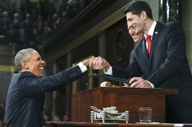 Barack Obama is welcomed by Paul Ryan and Joe Biden prior to delivering his final State of the Union address, January 12, 2016. (Reuters/Evan Vucci)