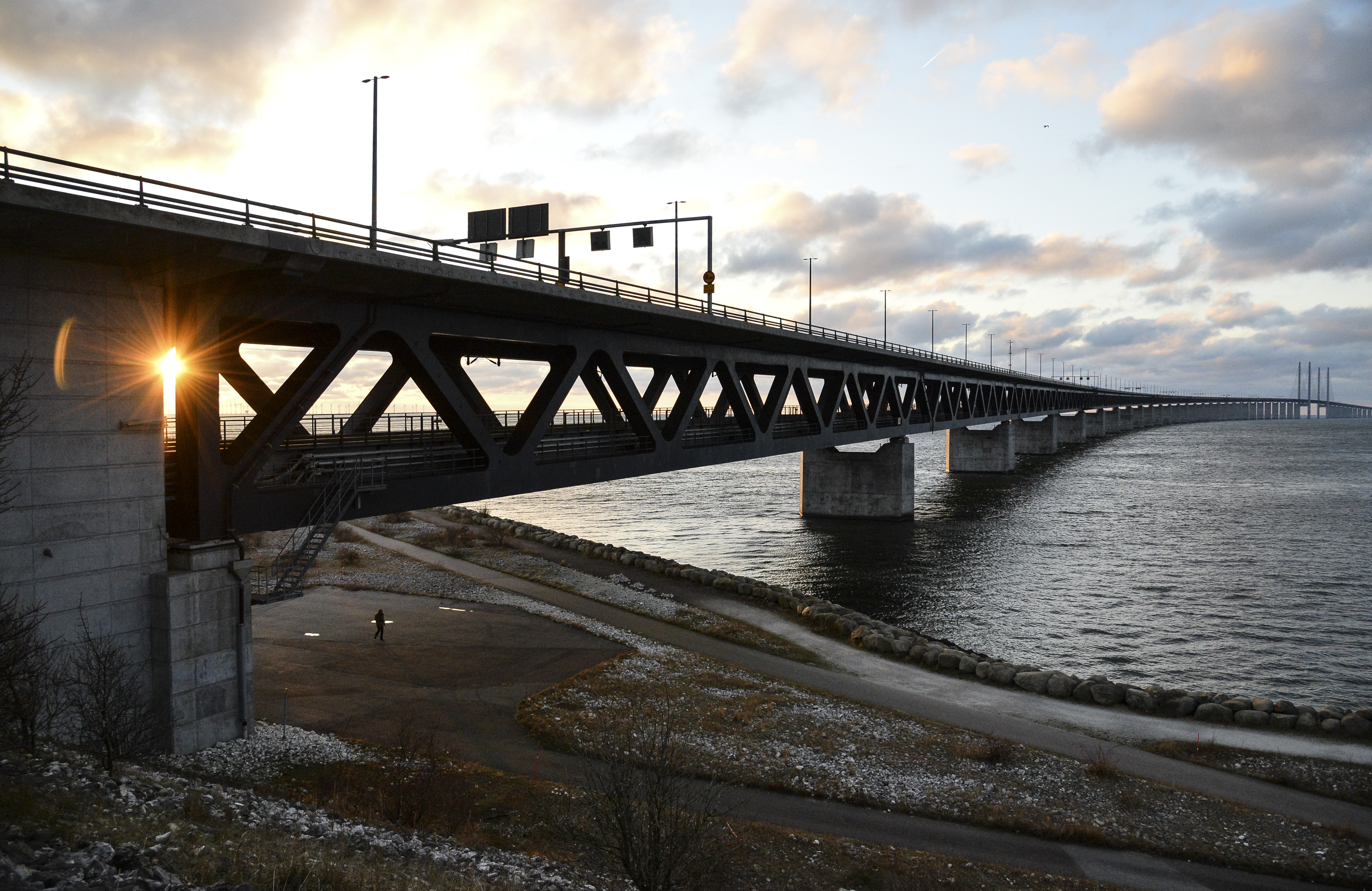 The sun sets over the Oresund Bridge between Sweden and Denmark, seen from Lernacken, Sweden, on Sunday Jan. 3, 2016  On upcoming Monday Jan. 4, 2016, new travel restrictions are set to be imposed by Sweden to stem a record flow of migrants, transforming the Oresund bridge between Sweden and Denmark into a striking example of how national boundaries are re-emerging in Europe. (Erland Vinberg /TT via AP, File)  SWEDEN OUT (AP)