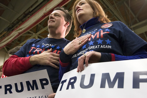 Donald Trump supporters recite the pledge of allegiance at a campaign stop at Concord High School, Jan. 18, 2016, in Concord, N.H. (AP/John Minchillo)