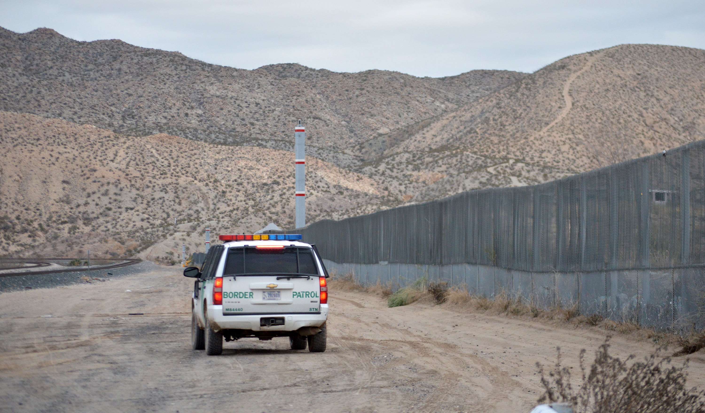 In this photo taken Jan. 4, 2016, a U.S. Border Patrol agent drives near the U.S.-Mexico border fence in Sunland Park, N.M. Officials in nearby El Paso, Texas, and Juarez, Mexico, are preparing for a Pope Francis visit to the Mexican city next month between Feb. 12-17. Juarez, on Mexico's northern border across from El Paso, is the last stop in the Pope's schedule 5-day trip to Mexico and the subject of immigration is expected to be part of the pope's agenda. ((AP Photo/Russell Contreras))