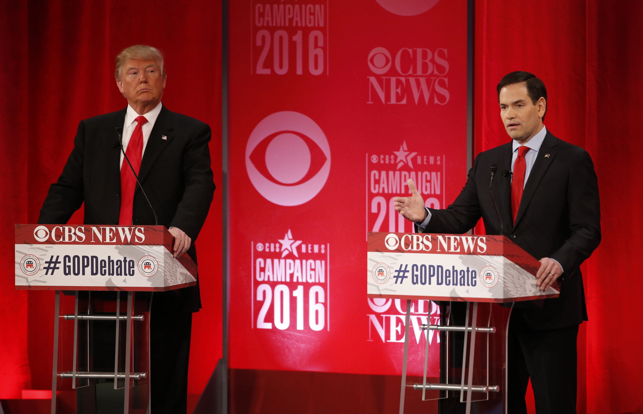 Republican U.S. presidential candidate businessman Donald Trump (L) listens as Senator Marco Rubio speaks at the Republican U.S. presidential candidates debate sponsored by CBS News and the Republican National Committee in Greenville, South Carolina February 13, 2016. REUTERS/Jonathan Ernst  - RTX26TM0 (Reuters)