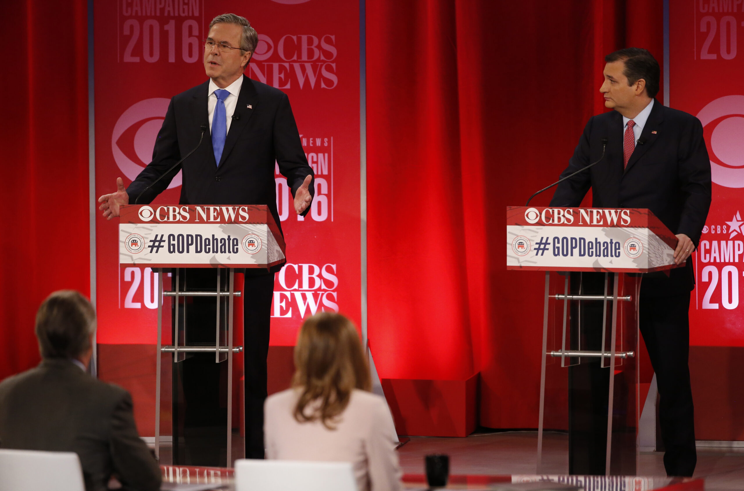 Republican U.S. presidential candidate and former Governor Jeb Bush (L) speaks as Senator Ted Cruz looks on at the Republican U.S. presidential candidates debate sponsored by CBS News and the Republican National Committee in Greenville, South Carolina February 13, 2016. REUTERS/Jonathan Ernst  - RTX26TM4 (Reuters)