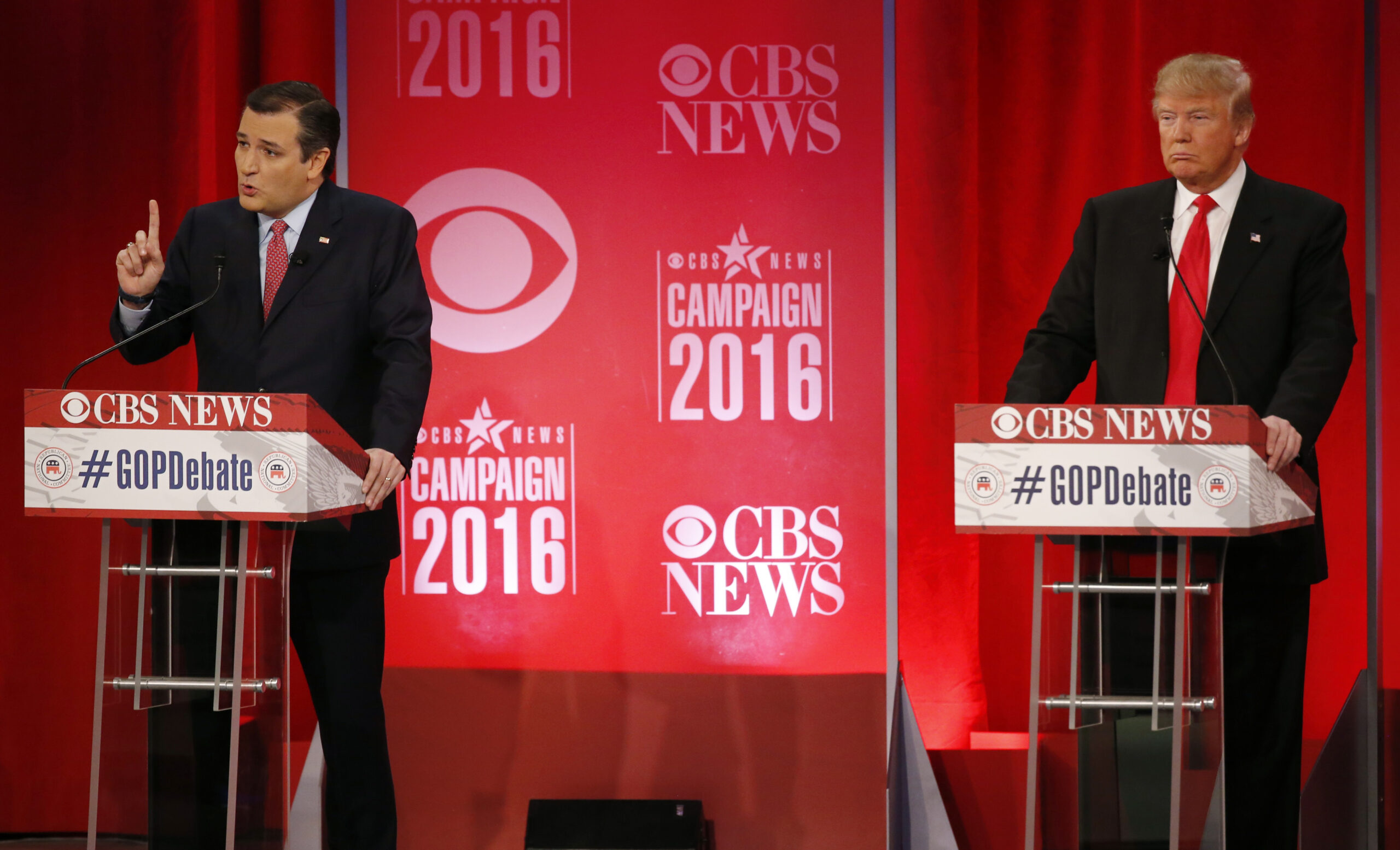 Republican U.S. presidential candidate and U.S. Senator Ted Cruz (L) speaks as businessman Donald Trump listens at the Republican U.S. presidential candidates debate sponsored by CBS News and the Republican National Committee in Greenville, South Carolina February 13, 2016. REUTERS/Jonathan Ernst  - RTX26TMP (Reuters)