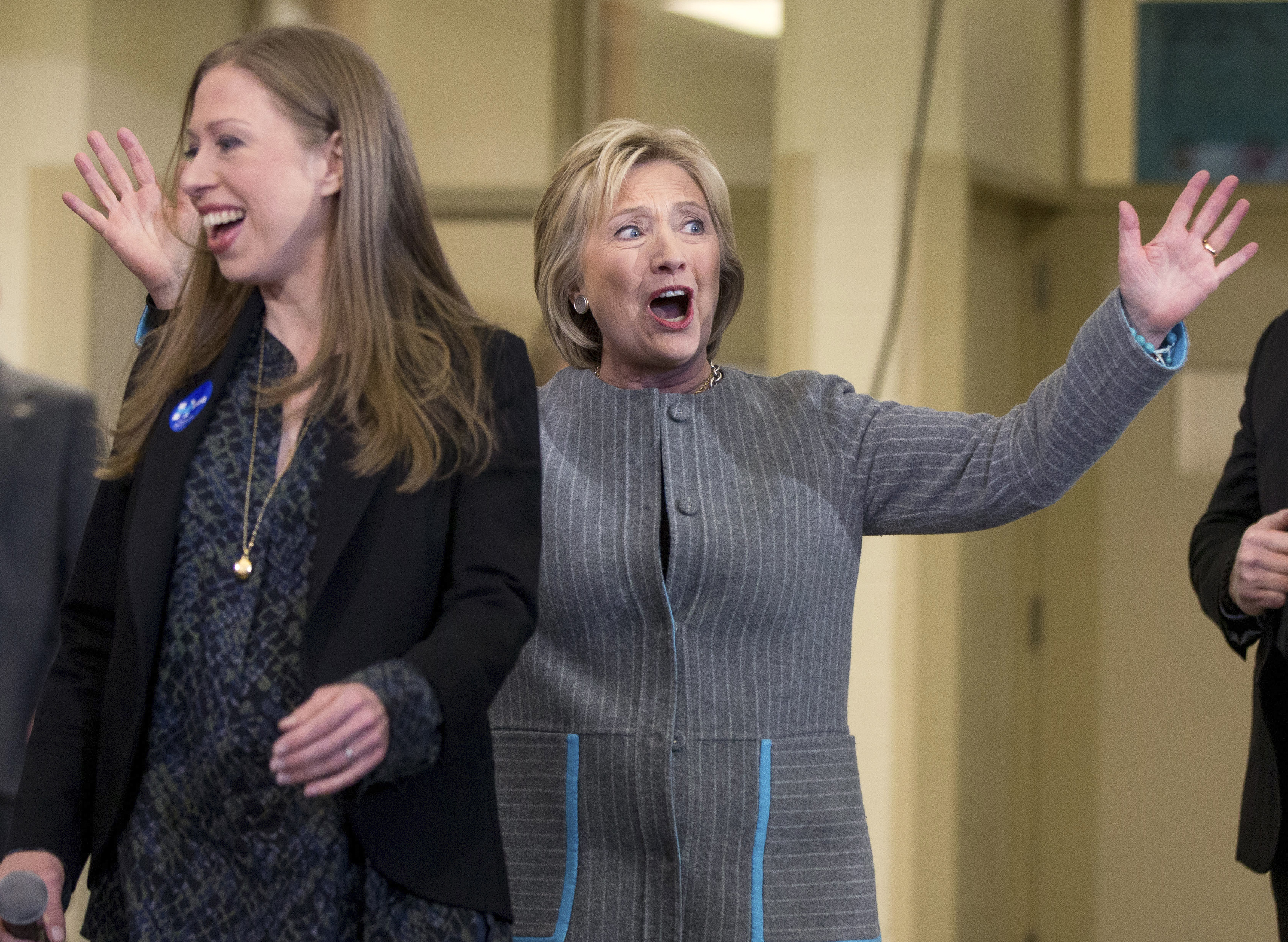 Democratic presidential candidate Hillary Clinton, accompanied by her daughter Chelsea Clinton, reacts to applause as she arrives for a rally at Abraham Lincoln High School in Council Bluffs, Iowa, Sunday, Jan. 31, 2016. (AP Photo/Andrew Harnik) (AP)
