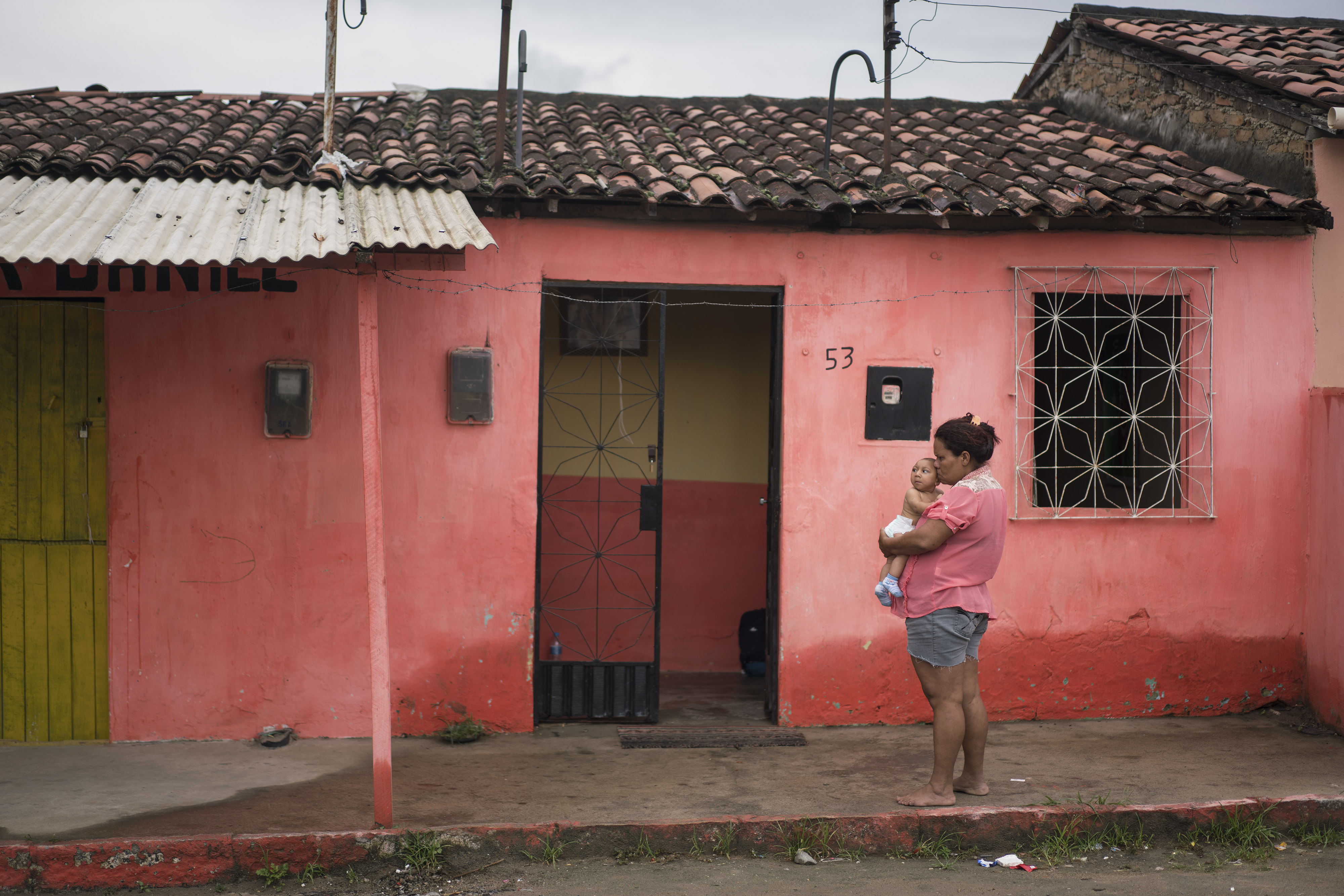 In this Jan. 30, 2016 photo, Solange Ferreira holds Jose Wesley outside their house in Bonito, Pernambuco state, Brazil. (AP/Felipe Dana)