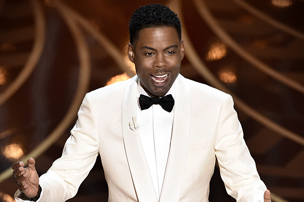 Chris Rock hosts the Oscars, Feb. 28, 2016, at the Dolby Theatre in Los Angeles. (AP/Chris Pizzello)