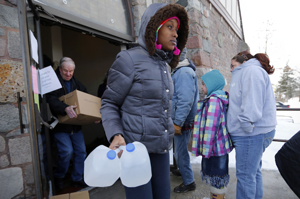 Water is distributed at the Lincoln Park United Methodist Church in Flint, Mich, Feb. 3, 2015. (AP/Paul Sancya)