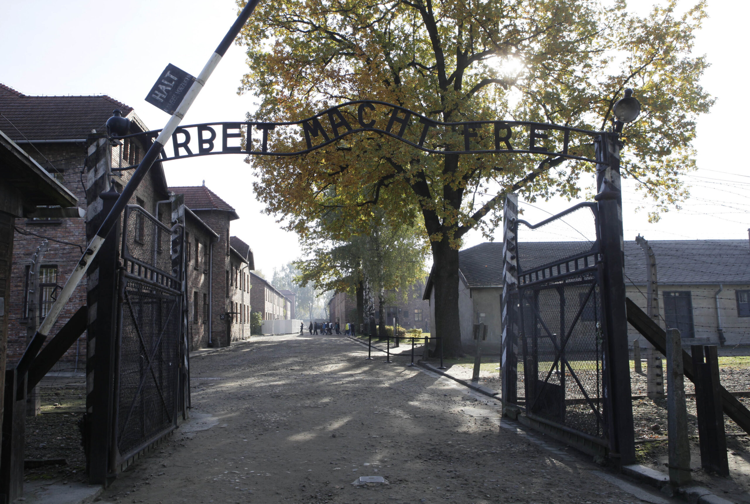 FILE - In this Oct. 19, 2012 file photo the entrance  with the inscription "Arbeit Macht Frei" (Work Sets You Free) gate of the former German Nazi death camp of Auschwitz is pictured at the Auschwitz-Birkenau memorial in Oswiecim, Poland. A 94-year-old former SS guard at the Auschwitz death camp is going on trial Thursday, Feb. 11, 2016 on 170,000 counts of accessory to murder, the first of up to four cases being brought to court this year in an 11th-hour push by German prosecutors to punish Nazi war crimes. (AP)