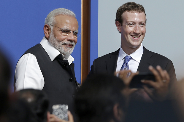 Narendra Modi, Prime Minister of India, poses for photos with Mark Zuckerberg after speaking at Facebook in Menlo Park, Calif., Sept. 27, 2015. (AP/Jeff Chiu)