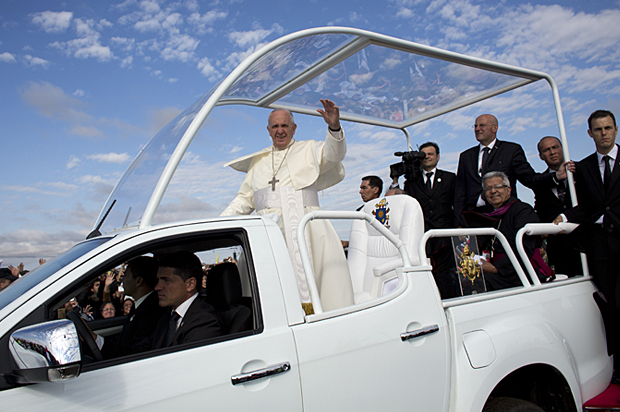 Pope Francis waves as he arrives in Paraguay, Sunday, July 12, 2015. (AP/Victor R. Caivano)