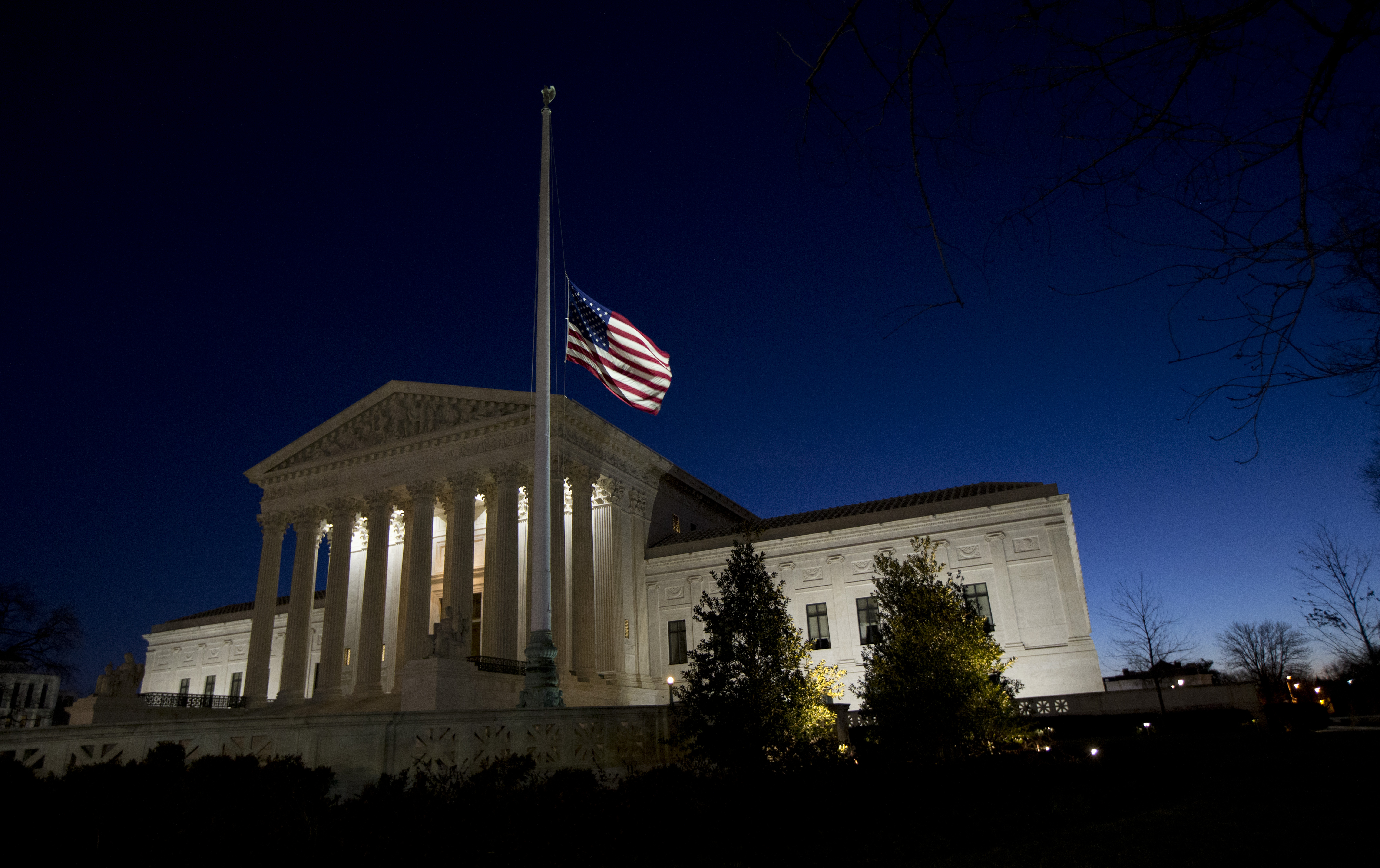 An American flag flies at half-staff in front of the U.S. Supreme Court building in honor of Supreme Court Justice Antonin Scalia as the sun rises in Washington, Sunday, Feb. 14, 2016. Scalia, the influential conservative and most provocative member of the Supreme Court, has died. He was 79. (AP Photo/Manuel Balce Ceneta) (AP)