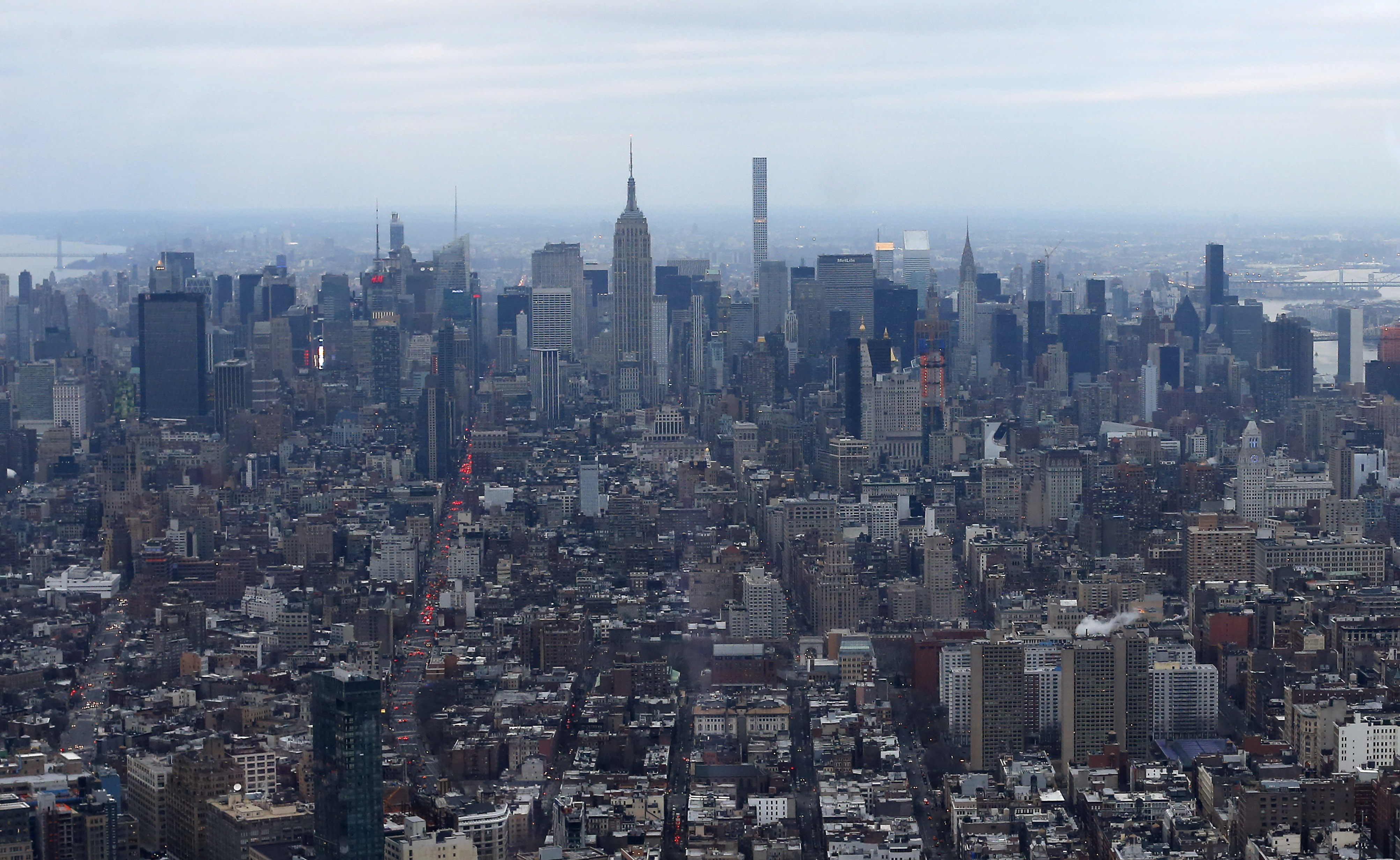 A super slim skyscraper at 432 Park Avenue competes with the Empire State building as it juts above the Manhattan skyline as seen from the One World Observatory, Wednesday, Feb. 17, 2016, in New York. Among the structures going up in the construction boom of recent years, there are a few that are reshaping the look of the skyline and doing it with footprints that take up a fraction of the space at ground level. (AP Photo/Julie Jacobson) (AP)