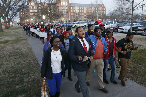 University of Oklahoma students march to the now closed University of Oklahoma's Sigma Alpha Epsilon fraternity house during a rally in Norman, Okla., March 10, 2015. (AP/Sue Ogrocki)