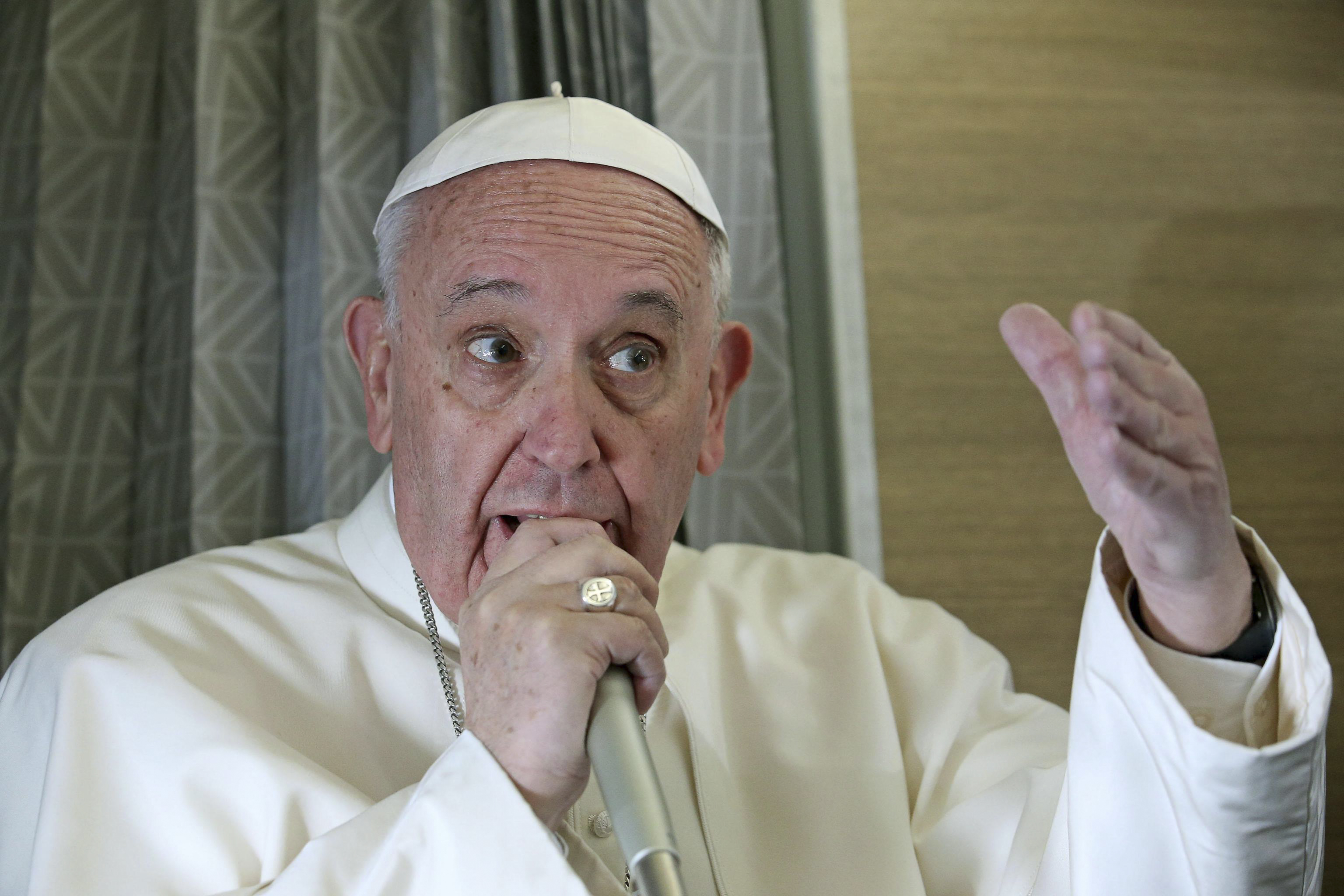 Pope Francis speaks to reporters aboard the plane during the flight from Rome to Habana, Cuba, on his way to a week-long trip to Mexico, Friday, Feb. 12, 2016. The pontiff is scheduled to stop in Cuba for an historical meeting with Russian Orthodox Patriarch Kirill that the Vatican sees as a historic step in the path toward healing the 1,000-year schism that split Christianity. (Alessandro Di Meo/Pool Photo via AP) (AP)