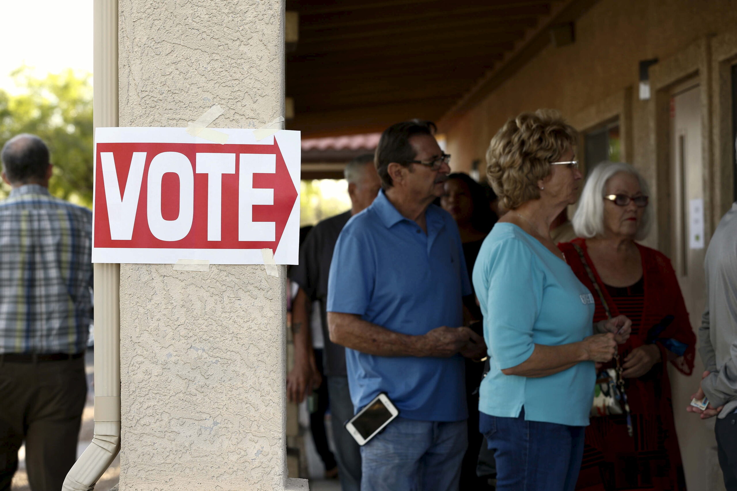 Voters wait in line at a polling site in Glendale, Arizona (Reuters)