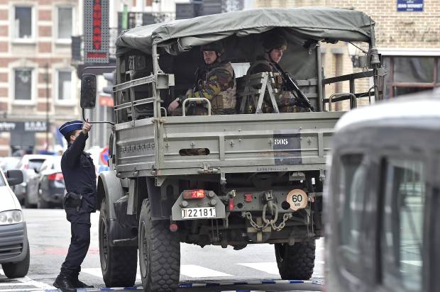 Police and military patrol the city center in Brussels, Belgium after attacks claimed by ISIS, on Tuesday, March 22, 2016 (AP/Martin Meissner)