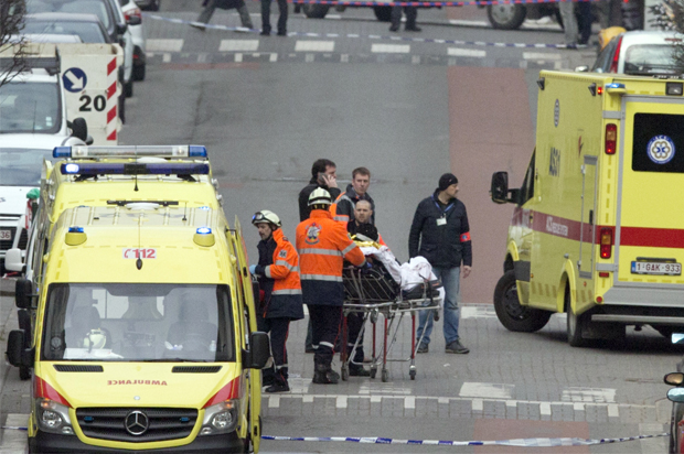 Emergency services evacuate a victim by stretcher after a explosion in a main metro station in Brussels on Tuesday, March 22, 2016. (AP/Virginia Mayo)