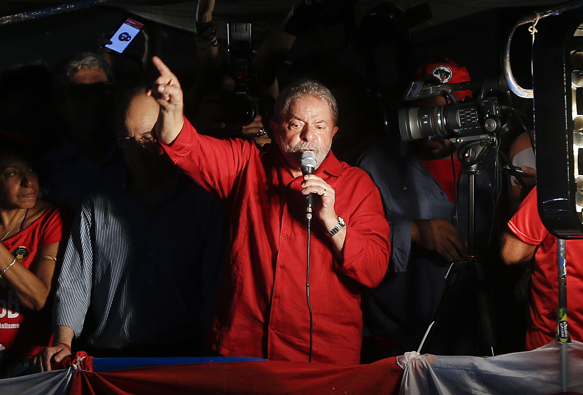 Brazil's former President Luiz Inacio Lula da Silva speaks during a rally in support of him and Brazil's President Dilma Rousseff, in Sao Paulo, Brazil, Friday, March 18, 2016. Supporters of Silva, who was one of the world's most famous leaders as president from 2003 to 2010, gathered for rallies in a handful of cities across Brazil, particularly in the industrial south, where the former factory worker has his base. Silva has been tied to a sprawling corruption investigation involving the Brazil oil giant Petrobras. (AP Photo/Andre Penner) (AP)