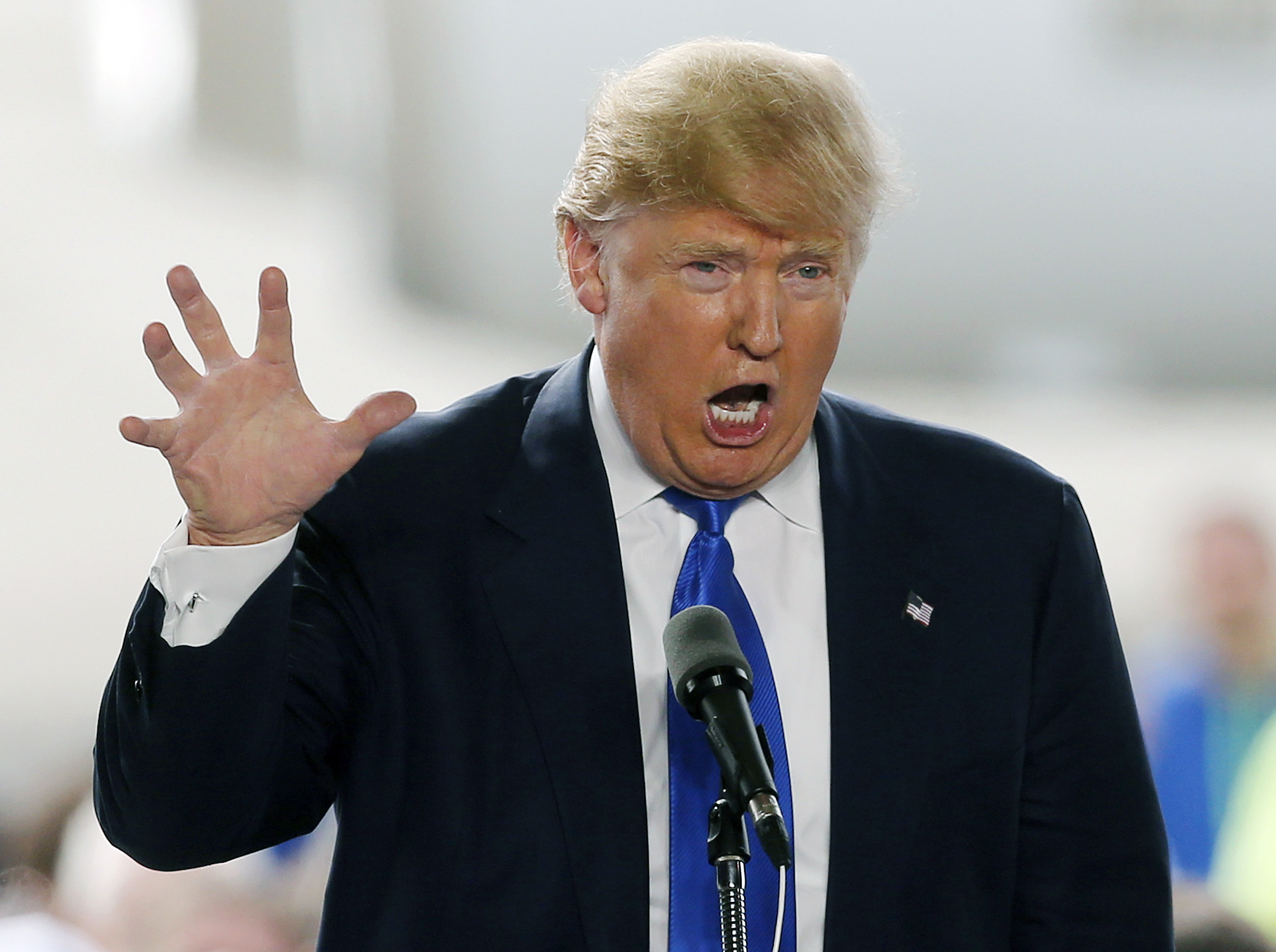 FILE - In this March 12, 2016, file photo, Republican presidential candidate, businessman Donald Trump speaks at the Wright Brothers Aero Hangar during a rally in Vandalia, Ohio. Over a period of 72 hours last week, the Republican front-runner faced a campaign crisis after unrest at his events forced him to cancel a rally in Chicago. He responded not by apologizing, but escalating, justifying his supporters violent reactions to protesters at his events and offering to pay legal fees. (AP Photo/Kiichiro Sato, File) (AP)