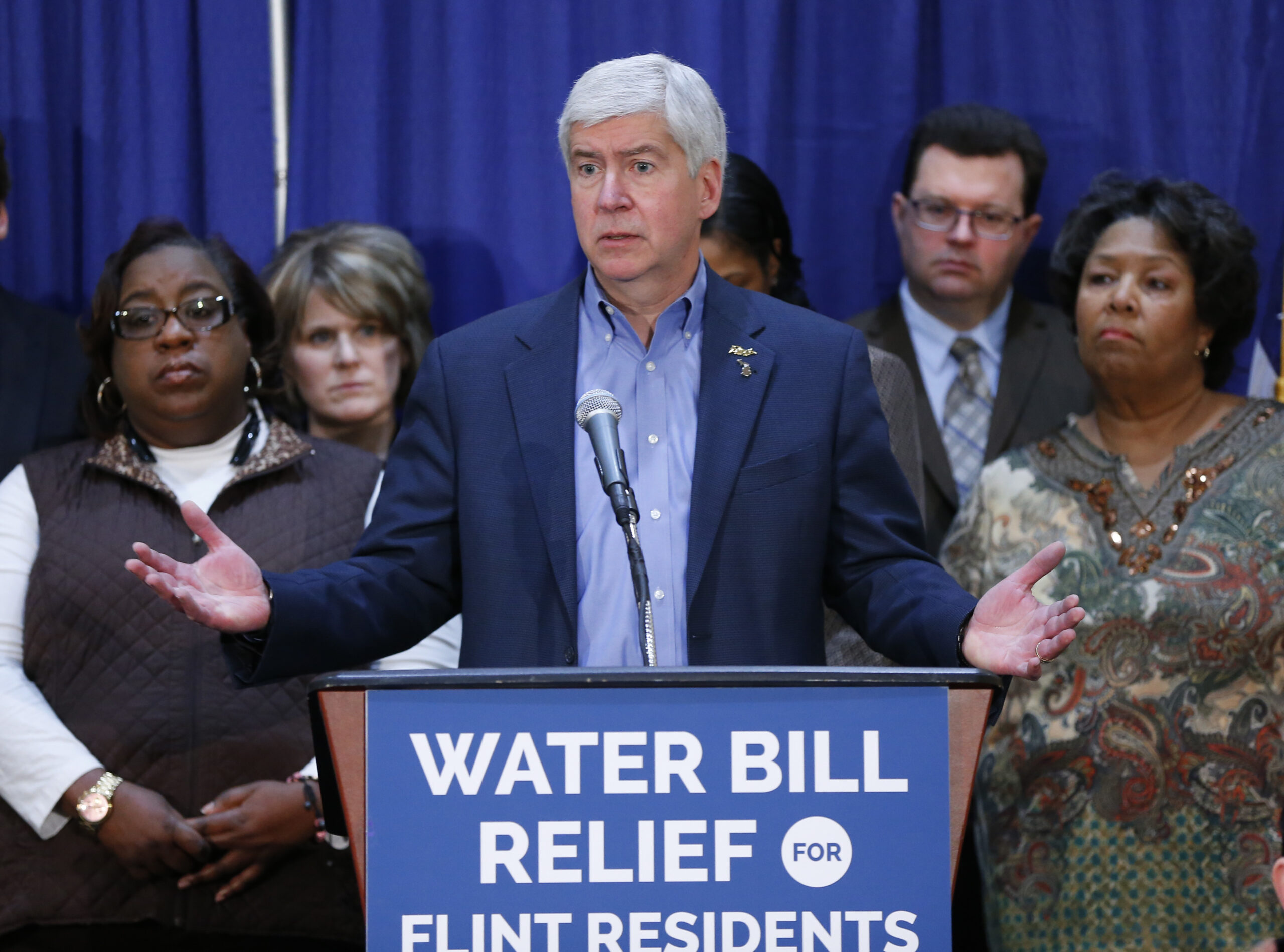 In this Feb. 26, 2016 photo, Gov. Rick Snyder speaks after attending a Flint Water Interagency Coordinating Committee meeting in Flint, Mich. The state of Michigan restricted Flint from switching water sources last April unless it got approval from Gov. Rick Snyder's administration under the terms of a $7 million loan needed to help transition the city from state management, according to a document released Wednesday, March 2, 2016. (AP Photo/Paul Sancya) (AP)