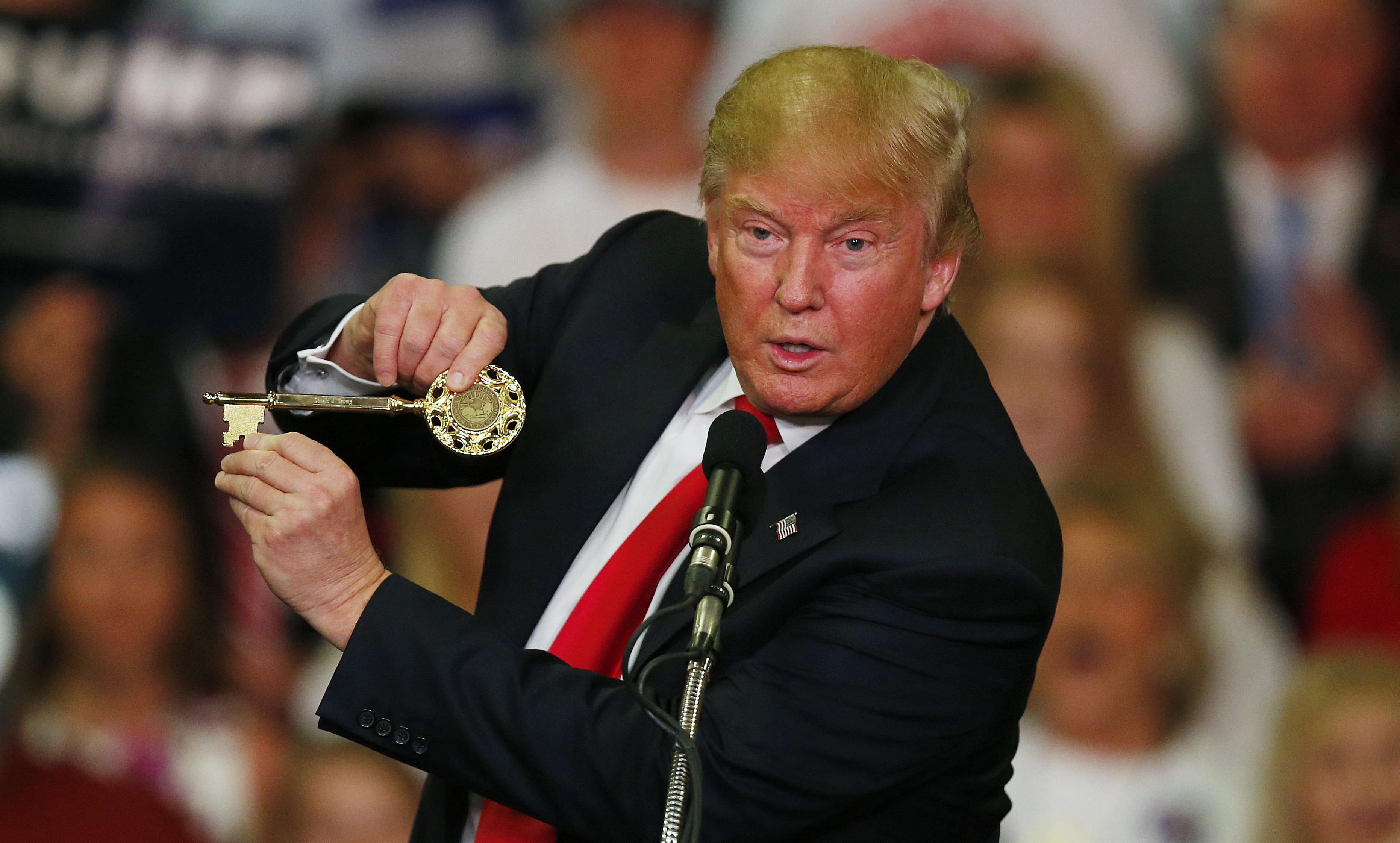Republican presidential candidate Donald Trump holds up a key to the city he brought onto stage with him as he speaks at a campaign rally Monday, March 7, 2016, in Madison, Miss. (AP Photo/) (AP/Brynn Anderson)