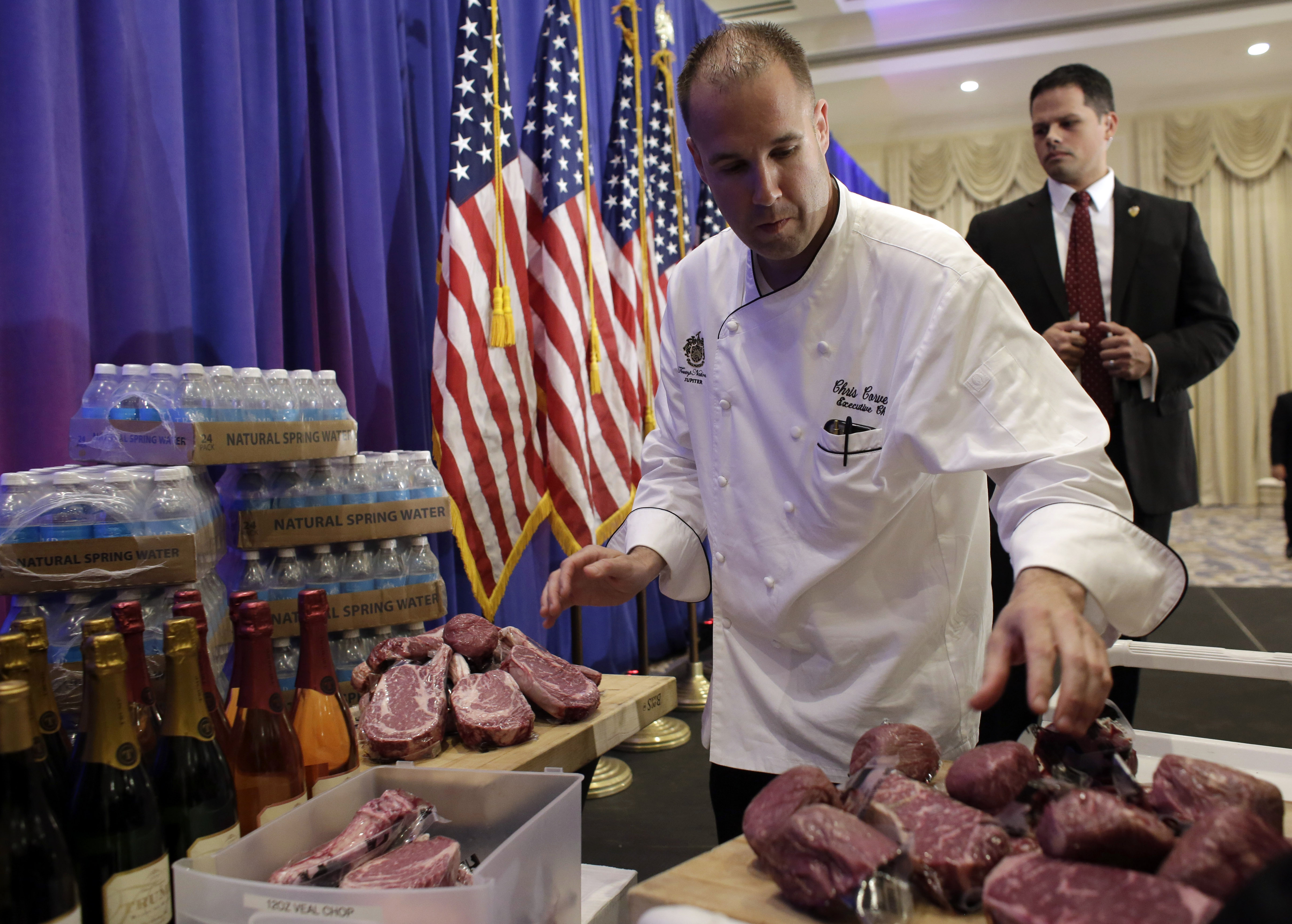 A chef with the Trump National Golf Club arranges alleged Trump steaks prior to Donald Trump's news conference on Tuesday (AP)