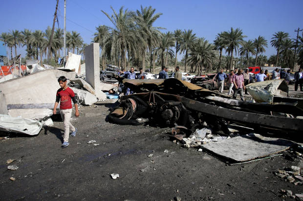 The scene of an ISIS suicide bomb attack in Hillah, south of Baghdad, Iraq, on Sunday, March 6, 2016 (AP/Anmar Khalil)