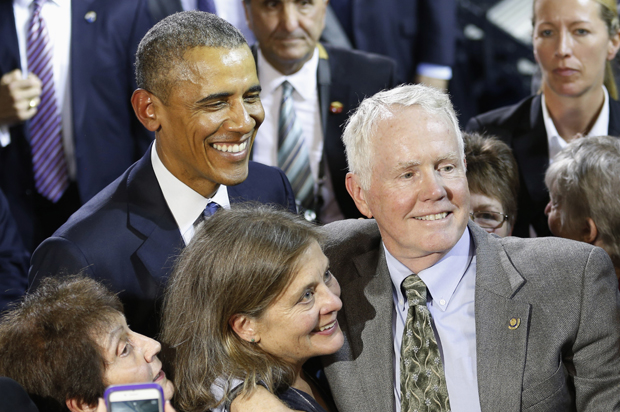 President Obama poses with David and Kate Grubb, parents of Jessica Grubb, in Charleston, WVa., Oct. 21, 2015. (AP/Steve Helber)
