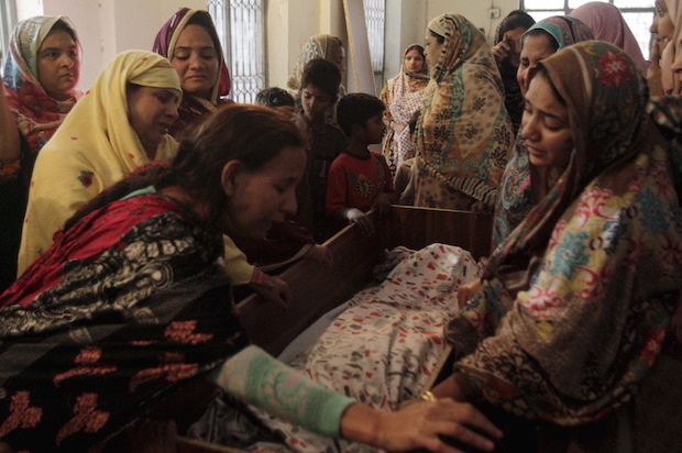 Family members mourn the death of a relative who was killed in a March 27 ISIS-linked attack at a public park in Lahore, Pakistan, on March 28, 2016 (Reuters/Mohsin Raza)