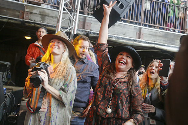Rachael Ray listens to Edward Sharpe and the Magnetic Zeros perform at her Feedback Party during the SXSW Music Festival, March 21, 2015. (AP/Jack Plunkett)