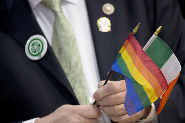 New York City Council Member Daniel Dromm holds the Irish Flag and the Gay Pride Flag during a news conference at the Irish Consulate, March 3, 2016, in New York. (AP/Mary Altaffer)
