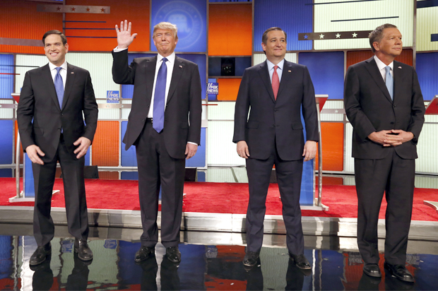 Republican presidential candidates, Sen. Marco Rubio, R-Fla., businessman Donald Trump, Sen. Ted Cruz, R-Texas, and Ohio Gov. John Kasich take the stage before a Republican presidential primary debate at Fox Theatre, Thursday, March 3, 2016, in Detroit. (AP Photo/Paul Sancya) (AP)