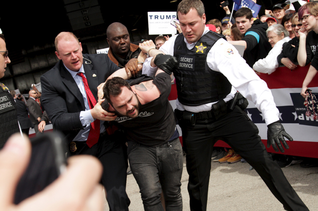 U.S. Secret Service agents detain a man after a disturbance at a Donald Trump rally in Dayton, Ohio March 12, 2016. (Reuters/William Philpott)