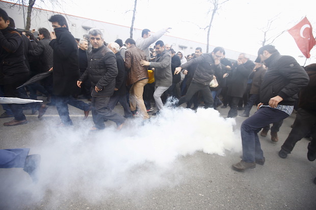 Turkish riot police use tear gas to disperse protesting employees and supporters of the Zaman newspaper, which the government violently seized control of, at its office in Istanbul, on March 5, 2016 (Reuters/Osman Orsal)