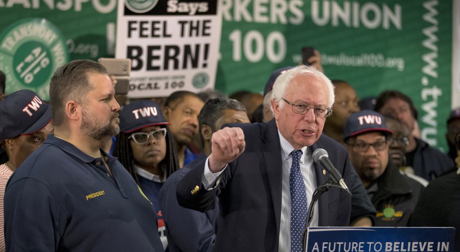 TWU Local 100 President John Samuelsen listens at left as Democratic presidential candidate, Sen. Bernie Sanders, I-Vt. speaks after being endorsed by TWU Local 100, Wednesday, April 13, 2016, in the Brooklyn borough of New York. (AP Photo/Mary Altaffer)